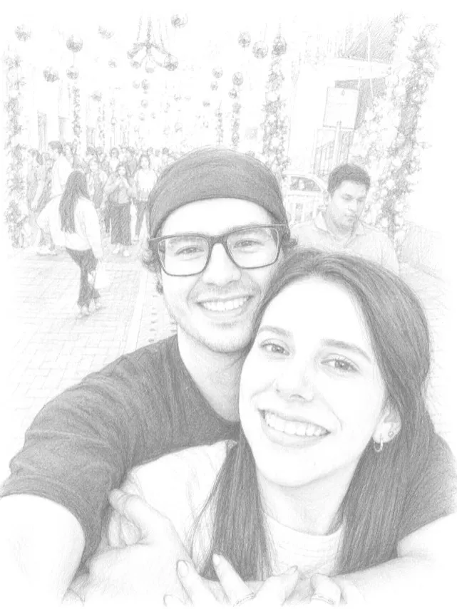 Dibujo a lápiz de un selfie de Francklin y Melissa en una calle iluminada
